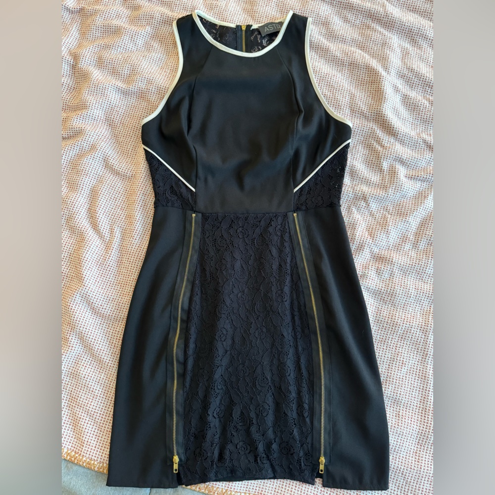 Mini Bodycon Black Dress with Lace detailing and Gold zippers.